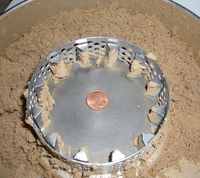 Brown leather inside a Variable Speed Rotor Mill: fine, voluminous after grinding.